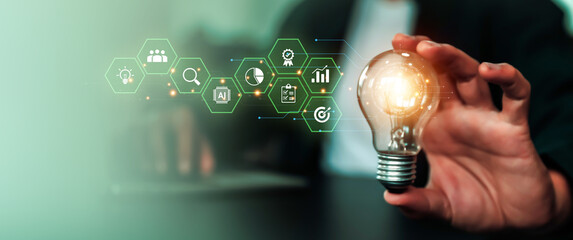 Hand choose light bulb with bright light and business plan icons for creative idea innovation of technology in analyzing global marketing online data management services to target growth concept.