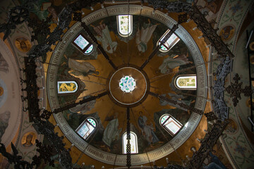 Stained glass ceiling in church . Low angle view . Religion concept - Powered by Adobe