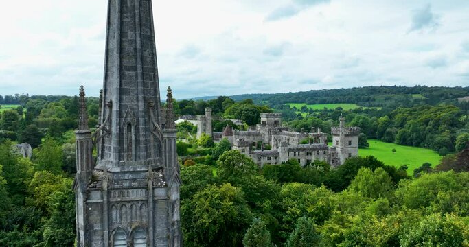 Ancient castle against the backdrop of green hills and trees