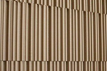 
vertical wooden acoustic wall panels in the concert hall