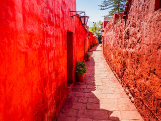 Beautiful alley in the ancient Santa Catalina monastery with bright red walls, Arequipa, Peru - 784316042