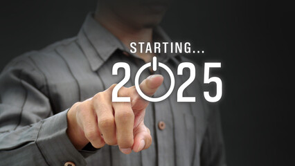 Man presses start button for new year 2025. Merry Christmas and new year, Planning and strategy...