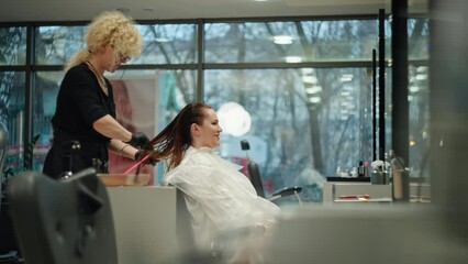 Transformative Beauty: Businesswoman's Salon Visit for Professional Hair Coloring and Lifestyle Enhancement. High quality 4k footage