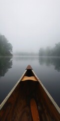 Foggy lake, close up, canoe bow cutting through, serene 
