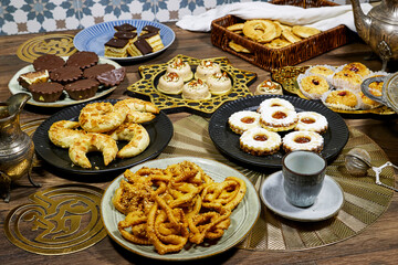 happy Eid Al fitr Concept, group of different tradition coookies of algeria on wood table for...