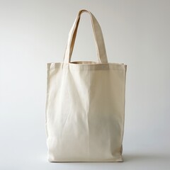 A plain beige tote bag stands against a white backdrop, ideal for eco-friendly branding and design mockups.