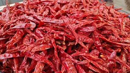 Fototapeta premium Dry hot red chillies on white background from top view
