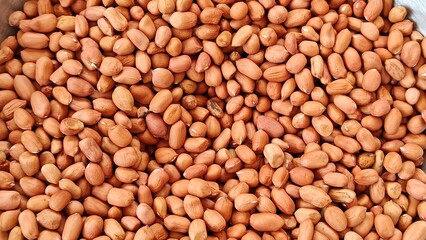plenty rosated peanuts in a Bowl Isolated on White Background