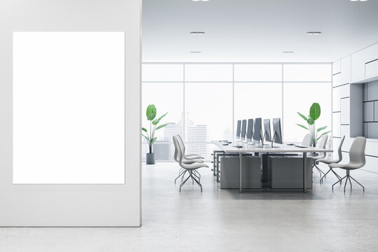 Modern office setting with blank poster and natural lighting. 3D Rendering