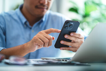 Male hand using smartphone to increase product and service concept points Customer Service Experience and Business Satisfaction Surveys