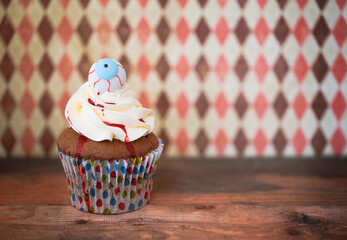 Halloween design cupcake on dark background