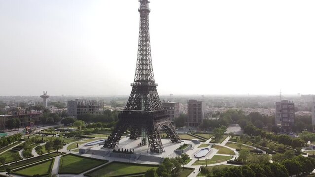Drone shot of an Eiffel tower with the cityscape around