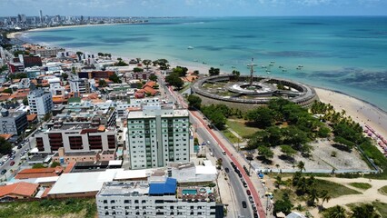 Aerial view of buildings and roads near the beach surrounded by the ocean