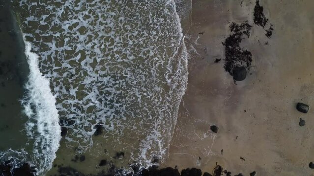 Aerial view of the sea waves in East Lothian, Scotland