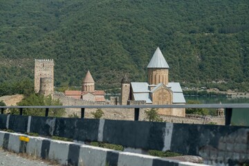 Beautiful view of the famous Georgian Ananuri castle on the background of a hill