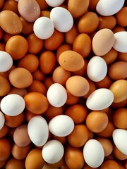 Top view of brown and white eggs at a local market