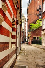 Vertical shot of a street with brick buildings