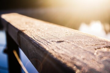 Closeup of a wooden plank in the morning.