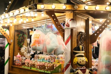 Closeup view of a Christmas Market stall with candy floss and a toy soldier