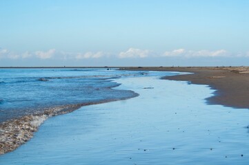 Seascape view on a sunny day with cloudy sky background