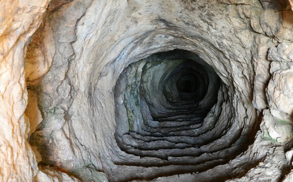 Narrow mine tunnel in a stone cave
