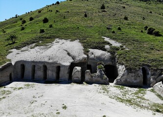High-angle view of stone caves at the Tepe Kermen under a hill in Crimea