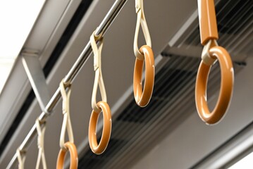 Low angle shot of round handles hanging on a train