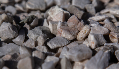Crushed stone close-up. Texture of road building material made of crushed stone. Small stone...