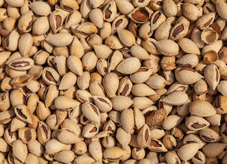 Unshelled almonds are sold in the market. - 784358458