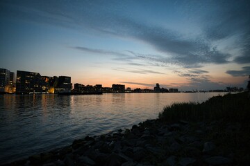 Fototapeta premium Scenic view of the beautiful city of Amsterdam seen during sunset