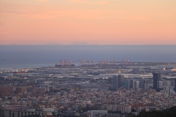 Aerial shot of the cityscape of Barcelona, Spain at sunset
