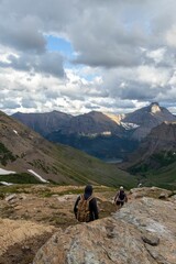 Beautiful view of man hiking the mountains in Glacier national park in Montana