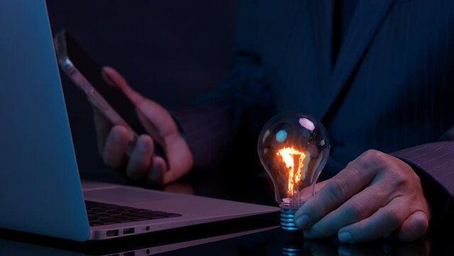 Creative thinking mindset concept. Idea, motivation, innovation, growth, imagination and inspiration. Personal development. Businessman showing glowing light bulb with fire inside.