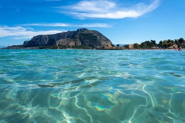 Beautiful crystal clear waters of sandy Mondello Beach in the Italian region of Sicily