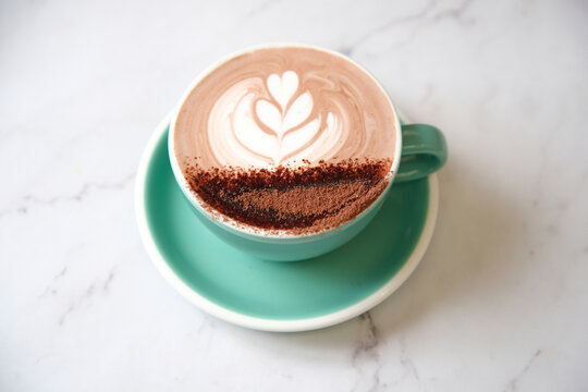 Hot chocolate in teal cup and saucer