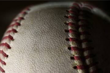Closeup of a detail of a white ball for playing baseball