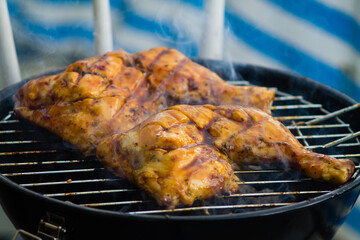 Closeup shot of a barbecue chicken on grill
