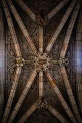 Vertical shot of a beautiful ancient ceiling with chandeliers