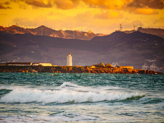 Sea coast and Tarifa town on skyline, Spain - obrazy, fototapety, plakaty