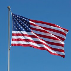 A large American flag is flying in the sky