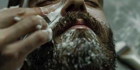 Close-up of a man shaving his beard with a razor. Perfect for grooming or personal care concepts