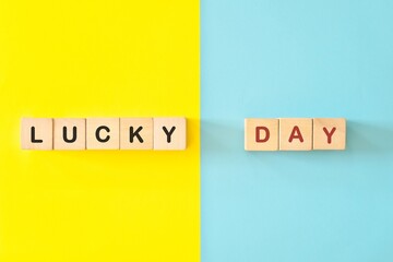 Lucky Day wooden blocks typography in bright blue and yellow background.