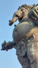 The Ganesha statue holding a banana, symbolizing nourishment and sustenance, Thailand.