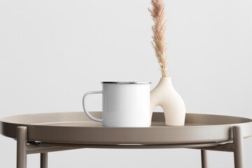 Enamel mug mockup with a pampas decoration on the beige table.