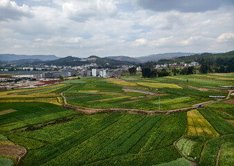Fototapeta na wymiar Aerial view of farmlands and towns in rural Yunnan Province in China