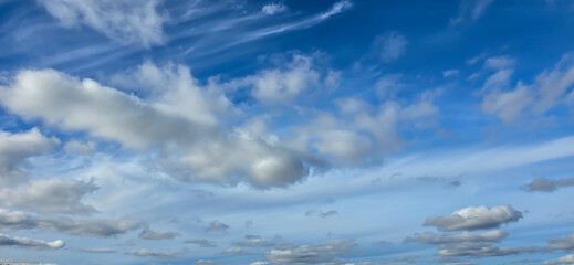 Blue sky background. Natural background. Panorama sky with tiny clouds