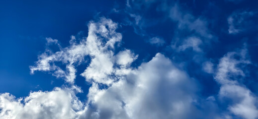 Blue sky background. Natural background. Panorama sky with tiny clouds