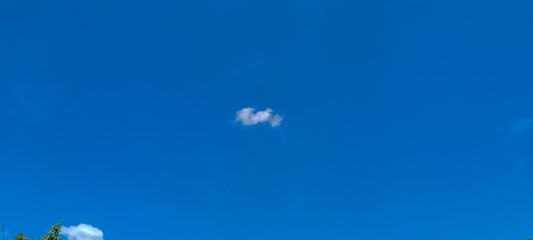 Blue sky background. Natural background. Panorama sky with tiny clouds