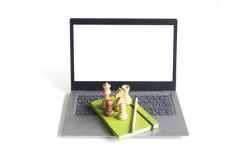 Chess piece on a laptop on white background - 784412462
