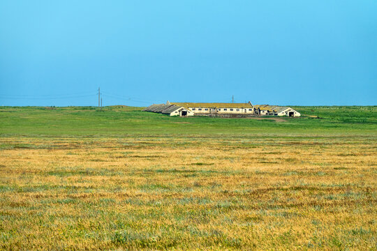 An old abandoned sheepfold shed with sheephouse (sheep farm) in the steppe. Soviet Union sheep industry (sheep-breeding sovkhoz - collective economy). Crimea